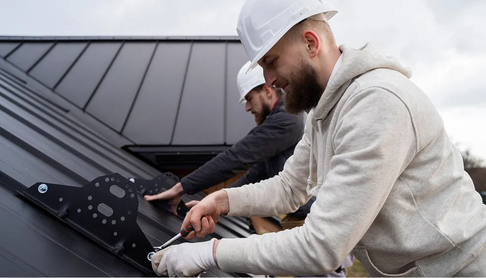 two technicians are repairing the roof